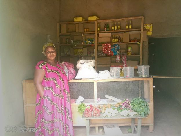 Iradukunda Emerance in the shop she opened through her savings group